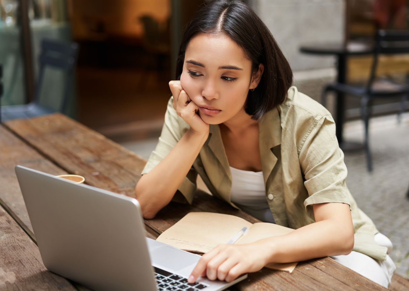 Woman-staring-at-laptop-frowning