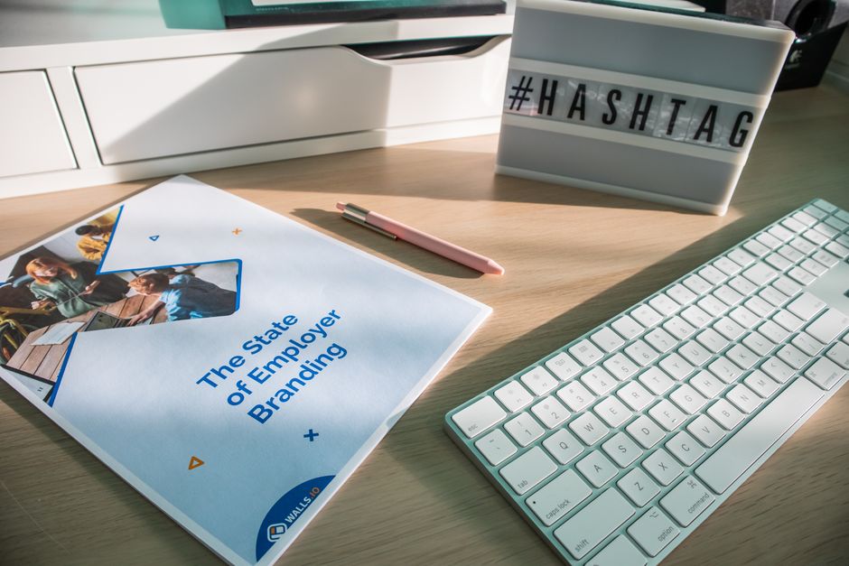 Brand book contents checklist on a desk