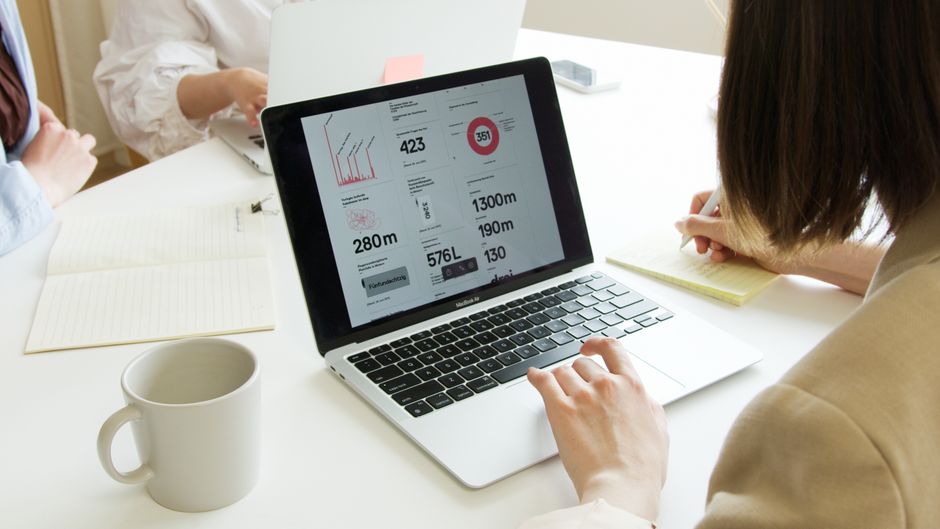 Business owner reviewing website analytics on a laptop