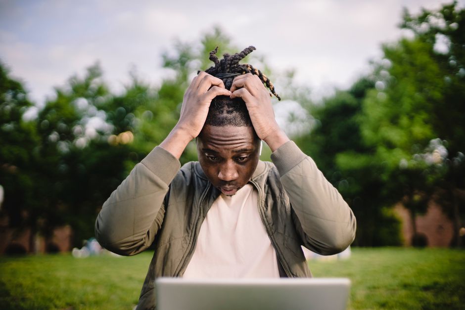 Frustrated business owner troubleshooting a DIY website builder