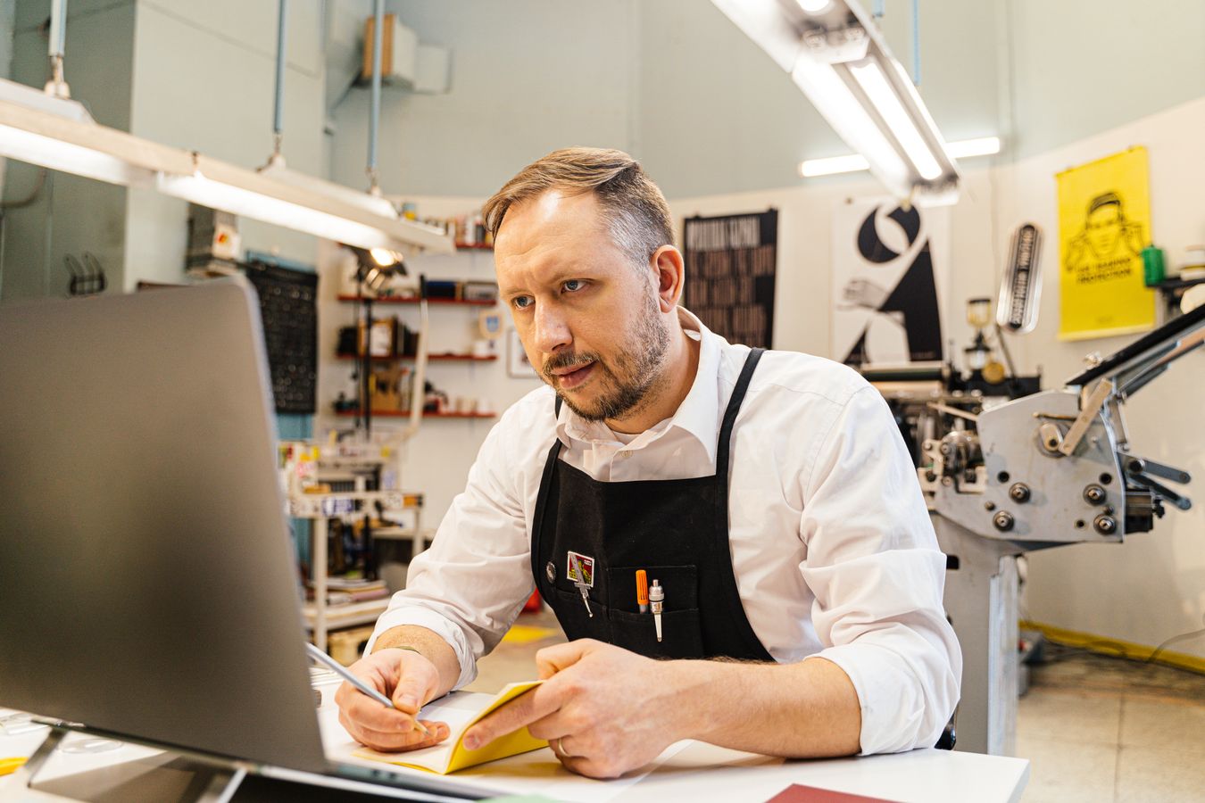 Small business owner comparing website builder options on a laptop