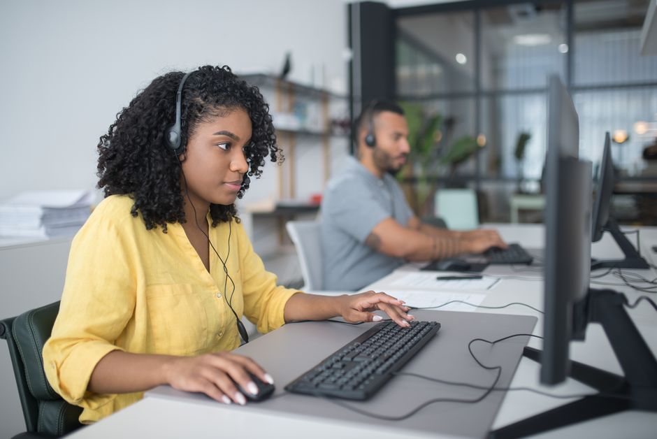 Customer service team supporting a client by phone