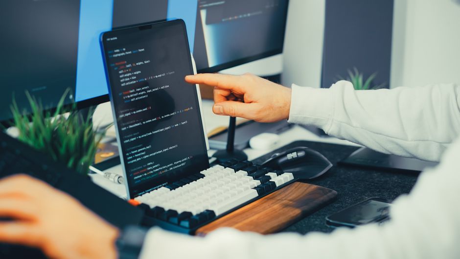Developer reviewing structured data code on a laptop