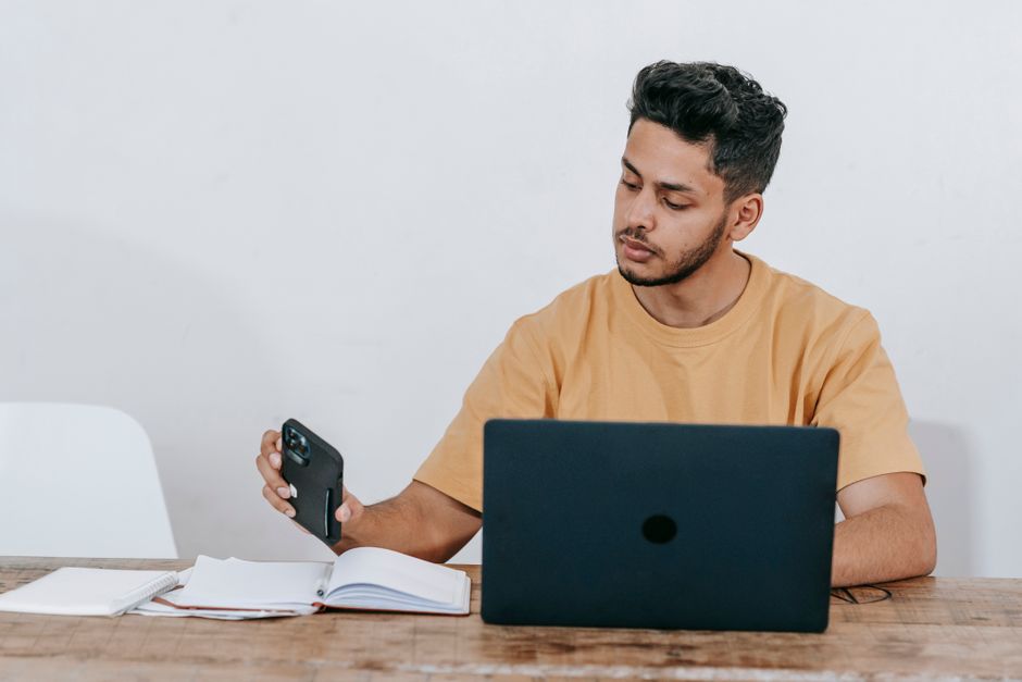 Small business owner checking a product listing on a phone