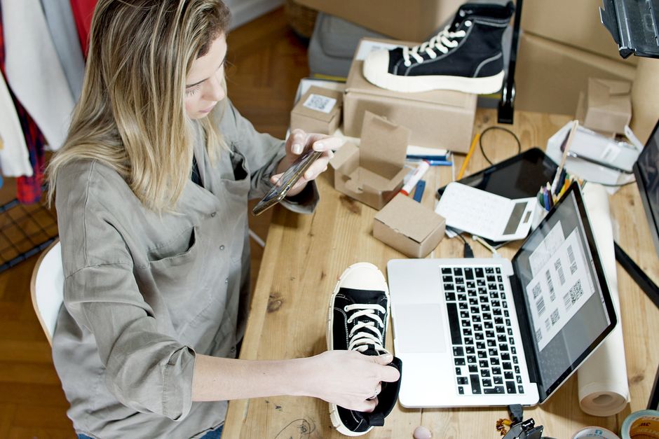 Seller photographing a product to prepare an online listing