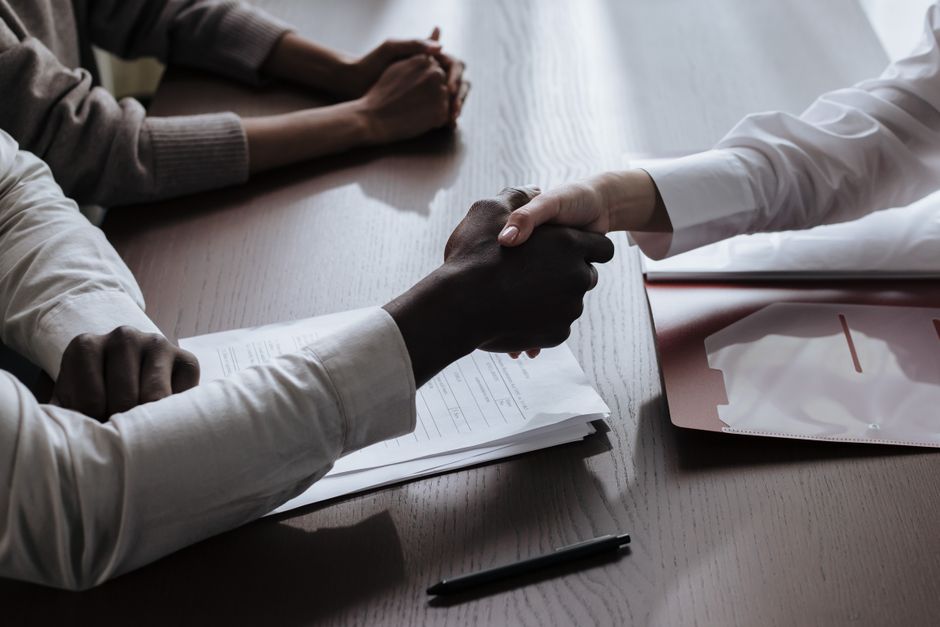 Small business owner signing a branding agency contract