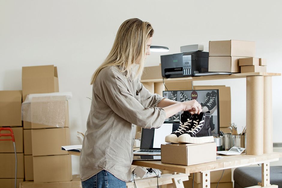Small business owner packing online orders