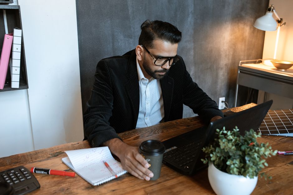 Business owner checking their website on a laptop