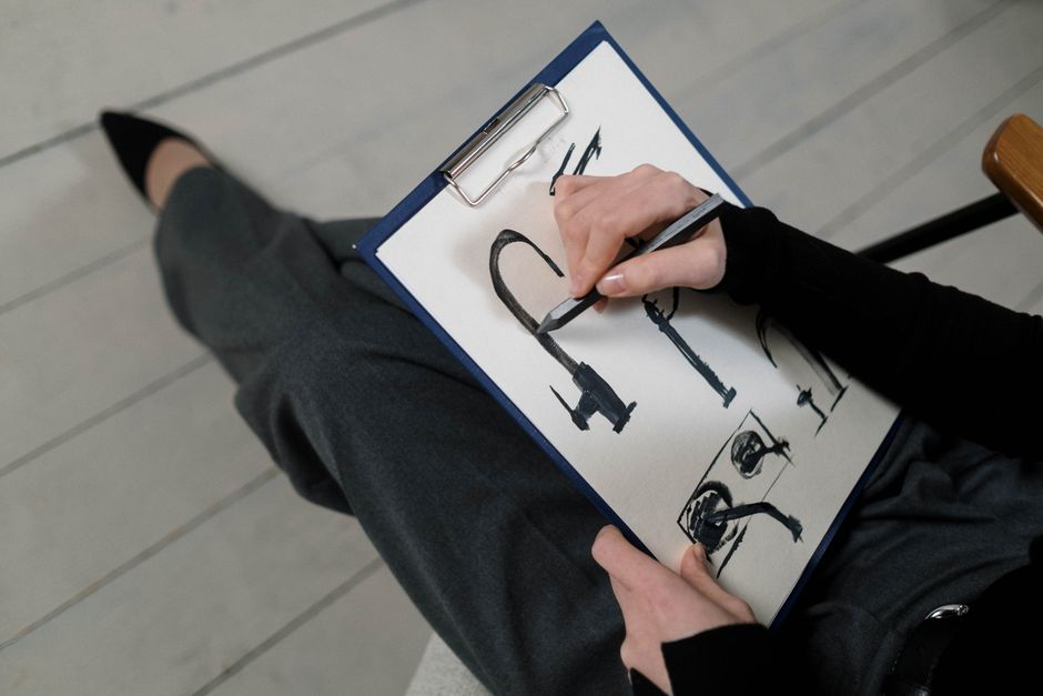 Designer sketching logo concepts by hand