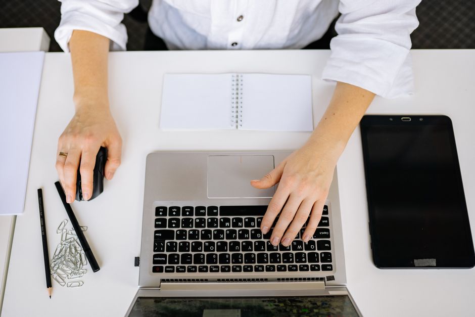 Researching AI search visibility at a laptop