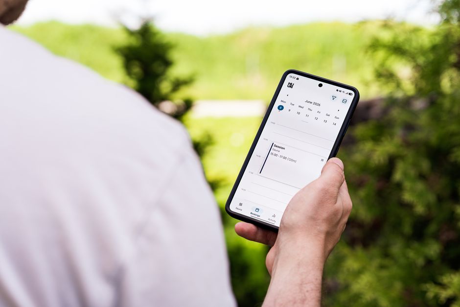 Customer viewing a booking app on a smartphone